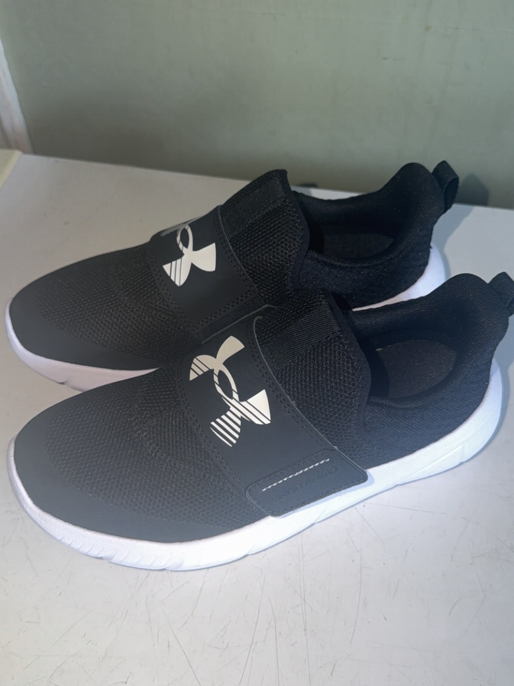 Under Armour Kids Black Slip-On Sneakers with White Sole
